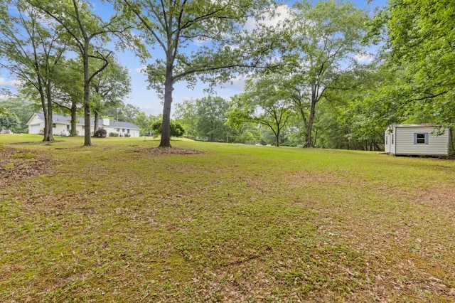 256 Teresa Ln, Loganville, GA 30052 - view of grassy yard with an outdoor structure