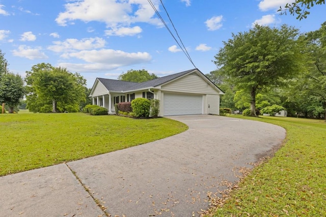 256 Teresa Ln, Loganville, GA 30052 - ranch-style house with concrete driveway, a garage, and a front lawn