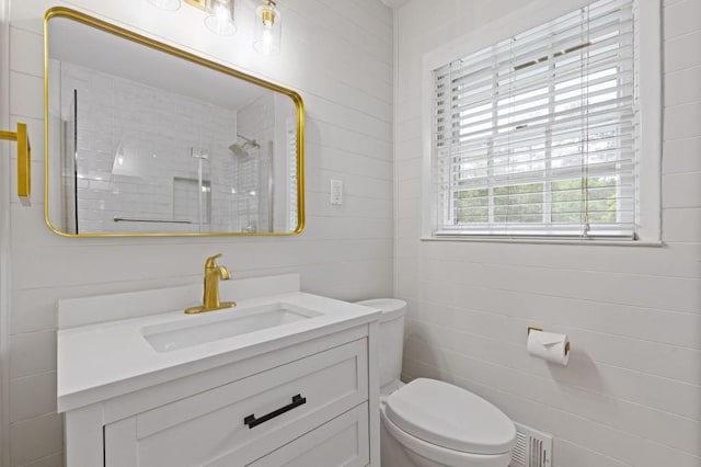 256 Teresa Ln, Loganville, GA 30052 - full bathroom featuring vanity, toilet, and a tile shower