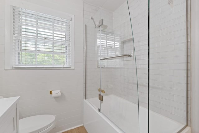256 Teresa Ln, Loganville, GA 30052 - full bath with vanity, toilet, enclosed tub / shower combo, and wood finished floors