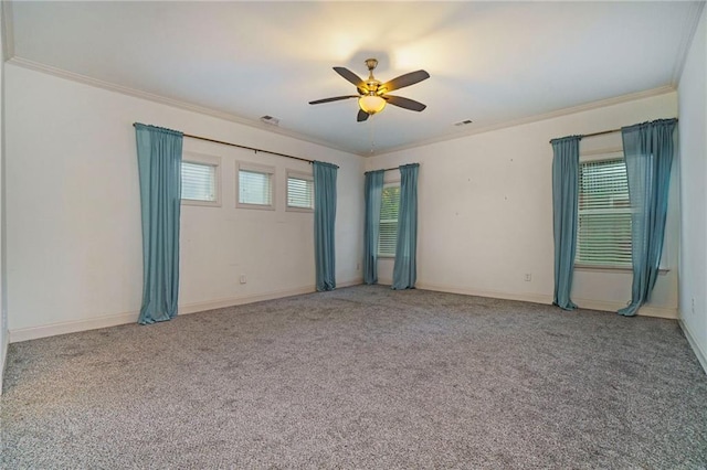 spare room featuring ornamental molding, carpet flooring, and ceiling fan