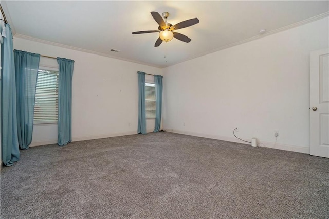 spare room featuring ornamental molding, carpet floors, and ceiling fan