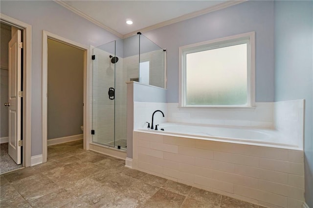 bathroom featuring ornamental molding and independent shower and bath