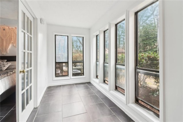 unfurnished sunroom featuring french doors