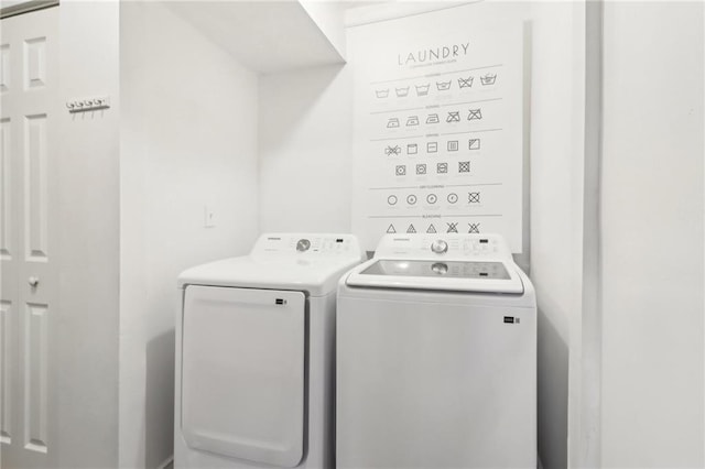 laundry area featuring washing machine and clothes dryer