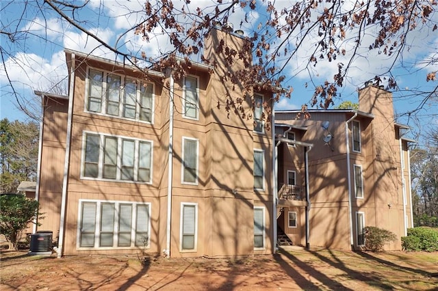 back of property with central AC unit