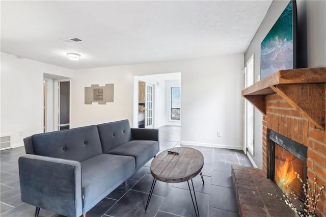 living room with a wealth of natural light and a fireplace