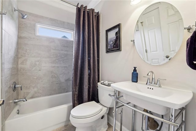 bathroom featuring shower / bath combo with shower curtain and toilet