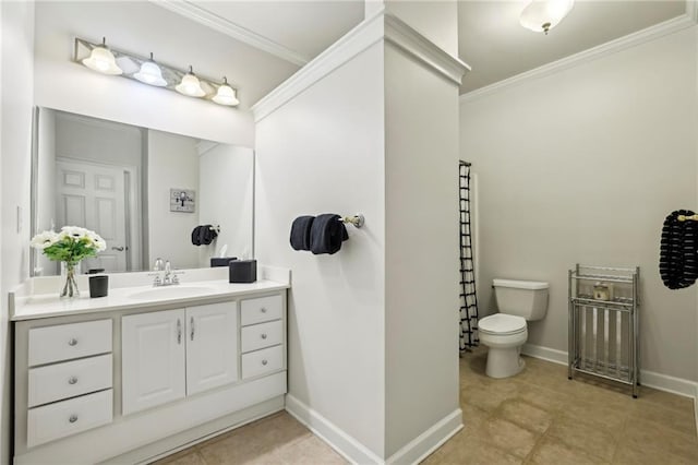 bathroom with crown molding, vanity, baseboards, and toilet