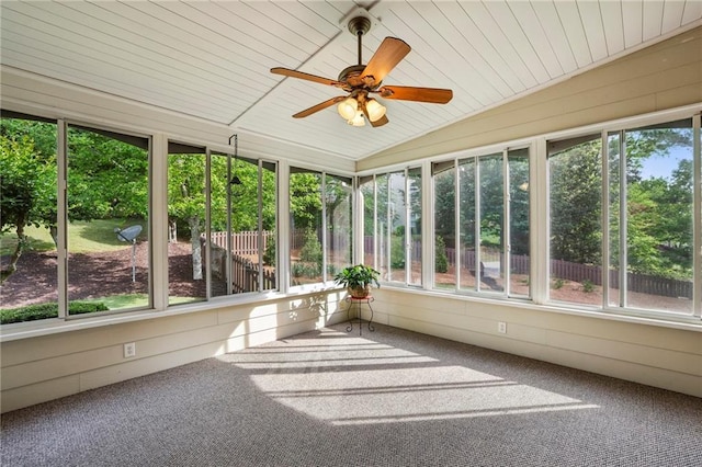 unfurnished sunroom with a ceiling fan