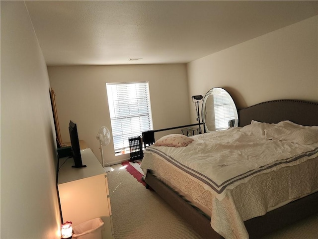 carpeted bedroom with visible vents