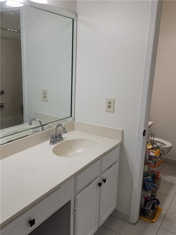 bathroom with tile patterned flooring and vanity