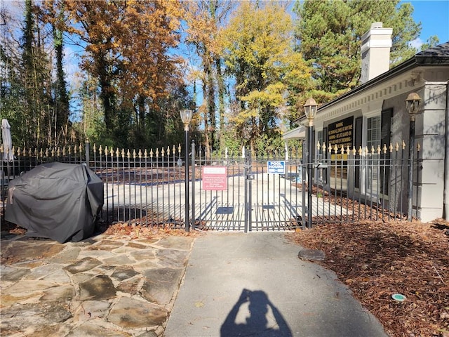 view of gate with fence