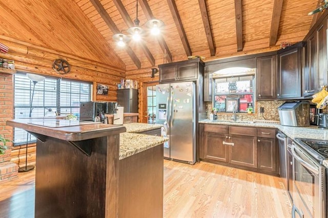 kitchen with beamed ceiling, appliances with stainless steel finishes, light wood-type flooring, and wood ceiling