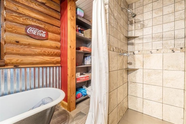 bathroom featuring separate shower and tub