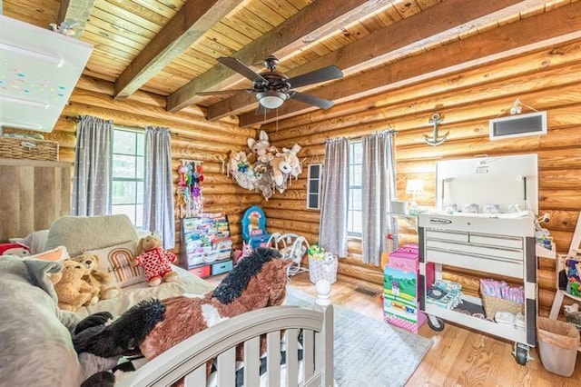 bedroom featuring beamed ceiling, log walls, wood ceiling, and hardwood / wood-style flooring