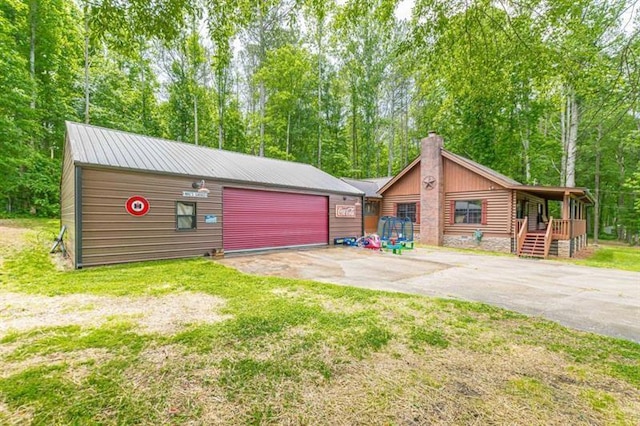 view of front of house with a front yard and a garage