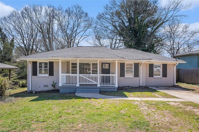 single story home with a porch, crawl space, fence, a front lawn, and brick siding