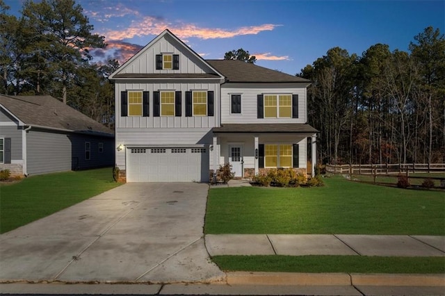 craftsman-style house featuring a garage and a lawn