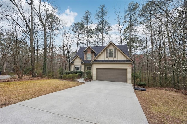 craftsman-style home with board and batten siding, concrete driveway, a front yard, roof with shingles, and a garage