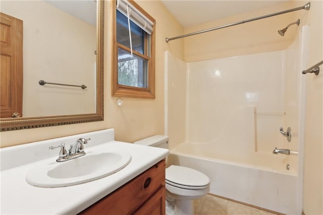 full bathroom with washtub / shower combination, vanity, toilet, and tile patterned flooring