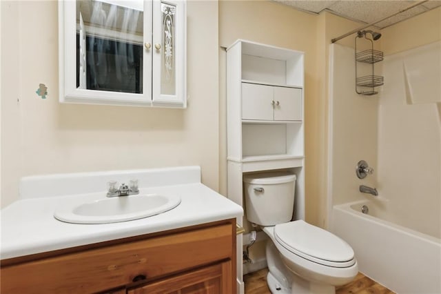 bathroom featuring shower / washtub combination, vanity, and toilet