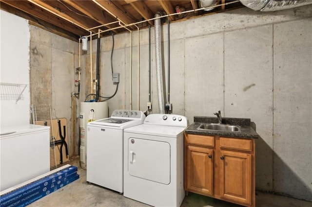 clothes washing area featuring cabinets, separate washer and dryer, sink, and water heater