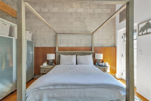 bedroom with wood finished floors