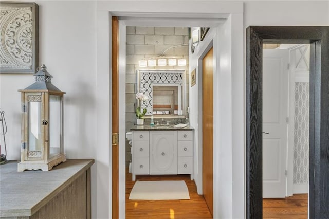 corridor with wood finished floors