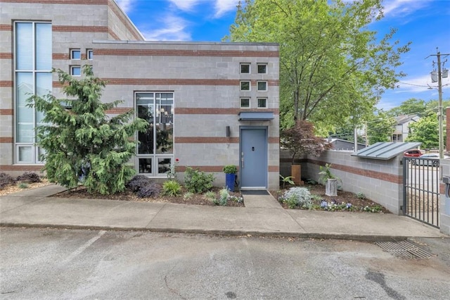 view of front of house with a gate and fence