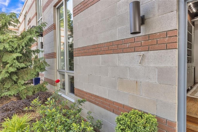 view of side of home featuring brick siding