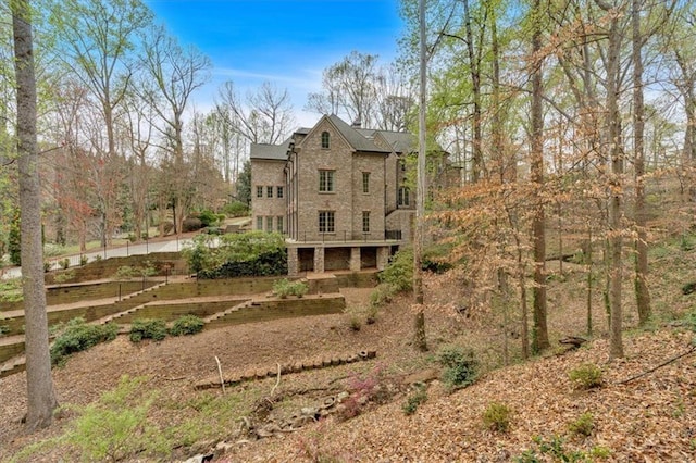 back of property with a vegetable garden