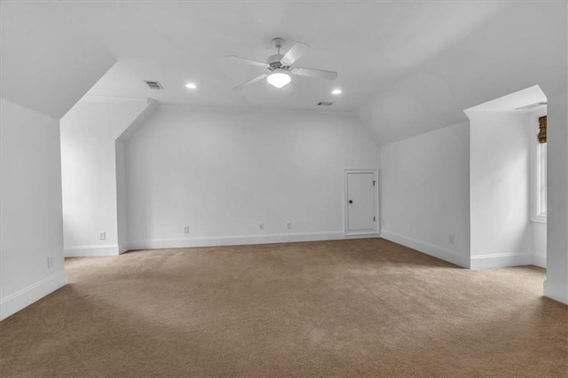 bonus room with visible vents, lofted ceiling, carpet floors, and a ceiling fan