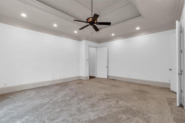 unfurnished room featuring carpet, a raised ceiling, a ceiling fan, ornamental molding, and recessed lighting