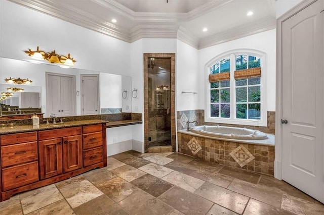 bathroom with a bath, a shower stall, ornamental molding, vanity, and stone tile floors