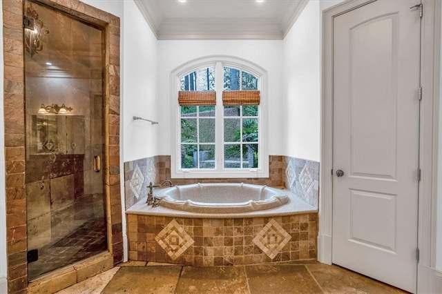 full bathroom featuring crown molding, stone tile flooring, and a garden tub
