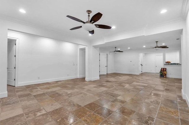 interior space with crown molding, baseboards, and ceiling fan