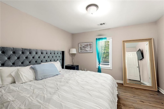 bedroom featuring hardwood / wood-style flooring