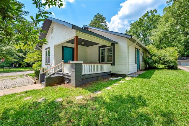 exterior space with a porch and a yard