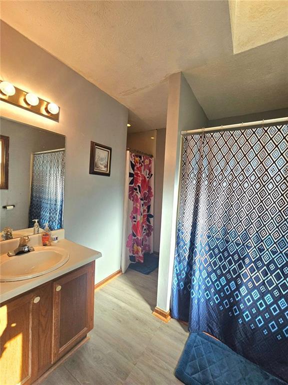 bathroom featuring vanity and a textured ceiling