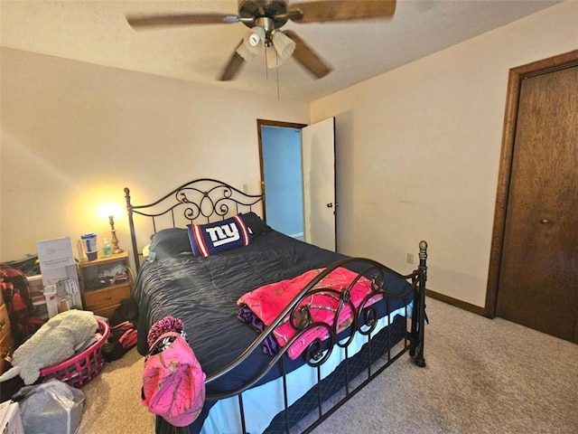 carpeted bedroom featuring ceiling fan