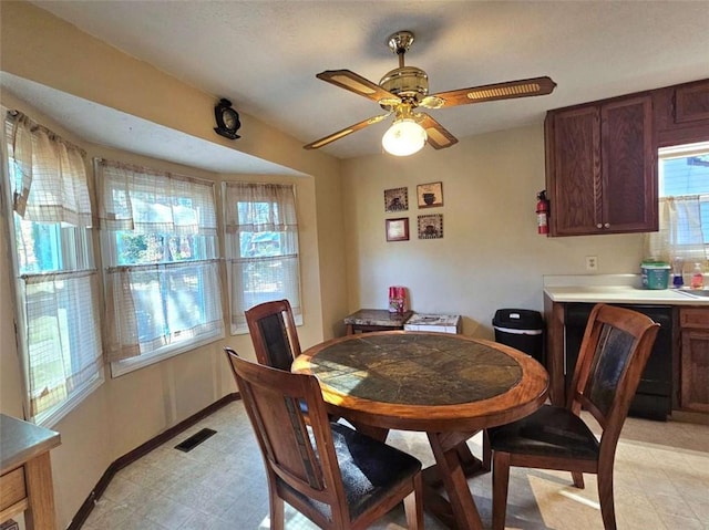 dining area with ceiling fan