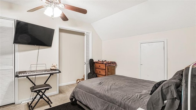 carpeted bedroom featuring ceiling fan and vaulted ceiling