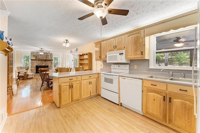 479 Deerpath Dr, Sautee Nacoochee, GA 30571 - kitchen featuring white appliances, a ceiling fan, a peninsula, a stone fireplace, and a textured ceiling