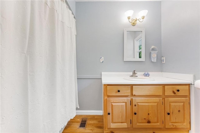 479 Deerpath Dr, Sautee Nacoochee, GA 30571 - bathroom with vanity, wood finished floors, and a shower with shower curtain