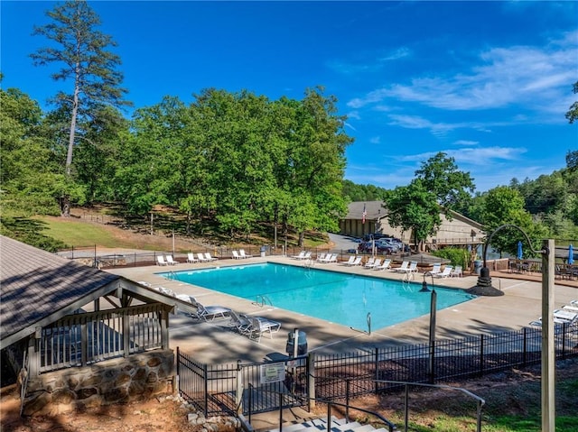 479 Deerpath Dr, Sautee Nacoochee, GA 30571 - community pool with a patio area and view of scattered trees