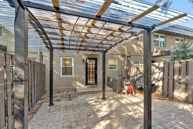 view of patio with fence and a pergola