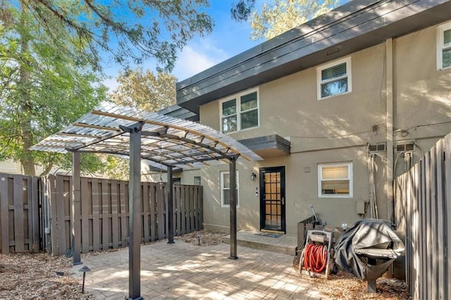 view of patio featuring a fenced backyard and a pergola