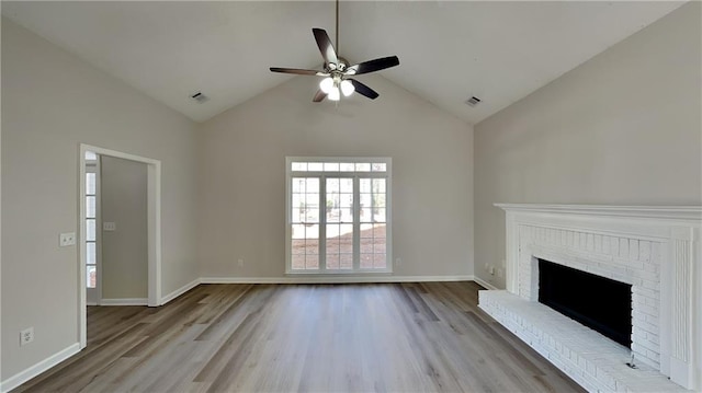 unfurnished living room featuring a fireplace, light wood-type flooring, high vaulted ceiling, and ceiling fan