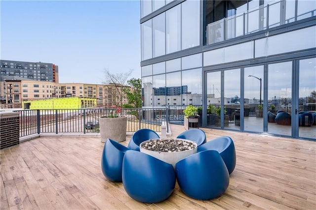 wooden deck featuring a view of city